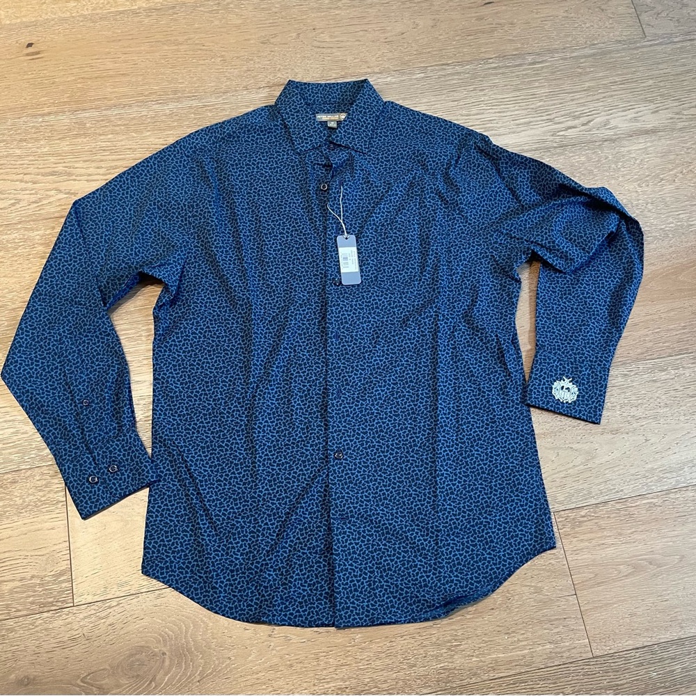 Peter Millar summer comfort, size M. Lakewood country club insignia on cuff.